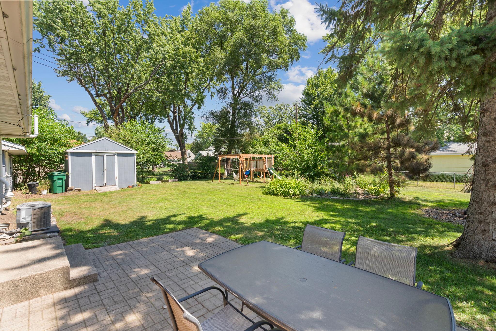 Great patio and tree coverage in backyard!