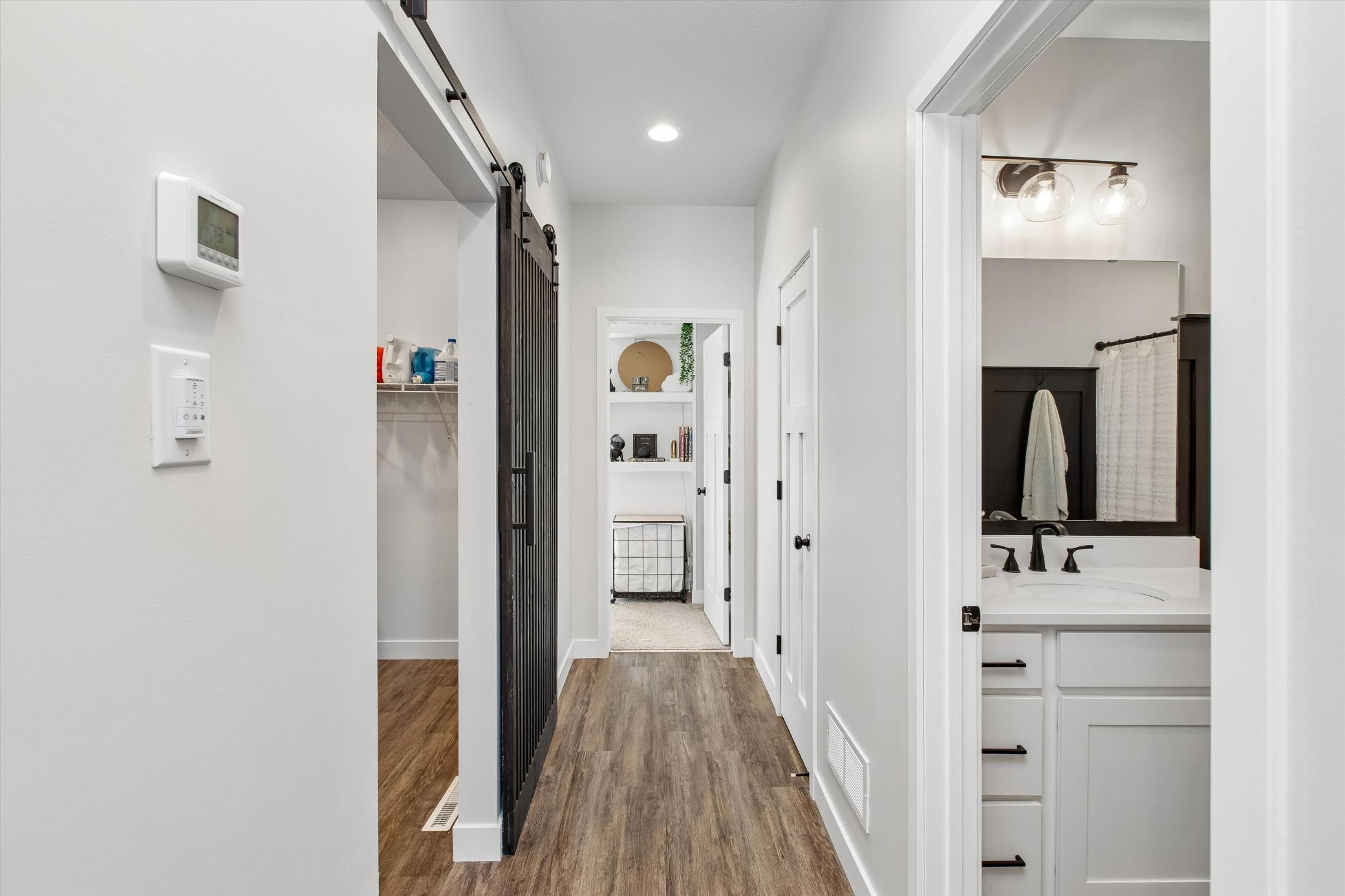 Stylish barn door closes off mud/laundry room