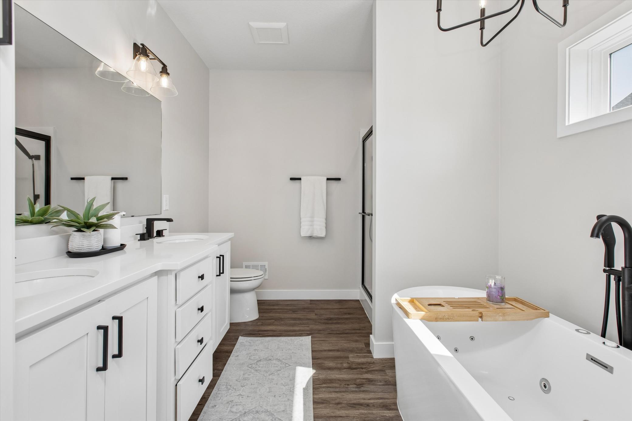 En-suite with dual sinks and soaker, jetted tub