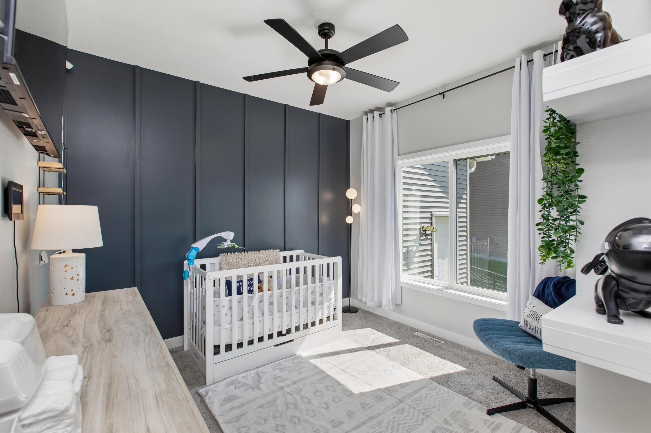 Board-and-batten in 2nd bedroom makes bedrooms cohesive