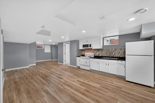 Welcome to a lower level designed with multigenerational living in mind