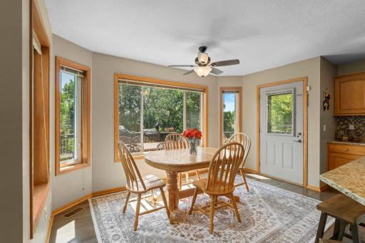 Informal dining area with picturesque views of the backyard.