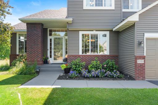 Additional highlights include an oversized three-car garage with drain, newer carpet & flooring, some newer windows, central vacuum system, sprinkler system, and the pride of ownership that shines throughout every room.
