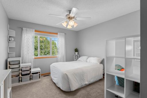 Second bedroom on the upper level with walk-in closet.