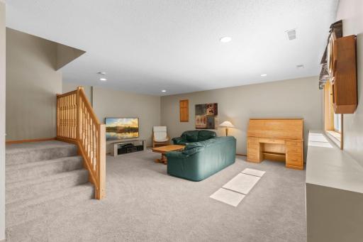 The expansive lower level offers radiant in floor heating, wet bar, additional living room, bedroom, bathroom, an ideal setup for an in-law suite or multi-generational living.