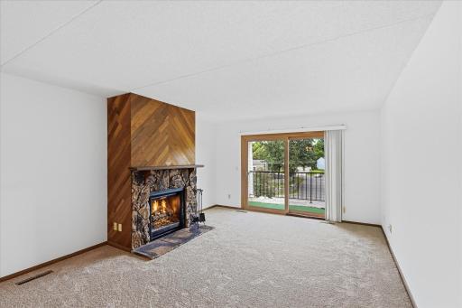 Living Room with Large Walkout Deck (Note: Fireplace Has Been Disabled).