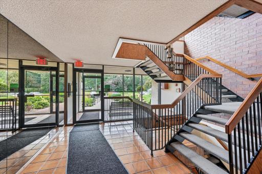 Front Lobby Area Has Stairs and an Elevator