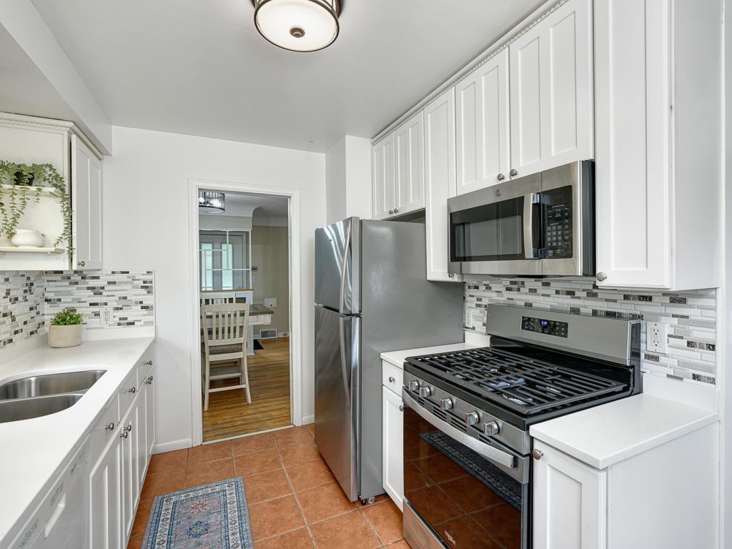Newer stainless appliances and lots of storage in the kitchen.