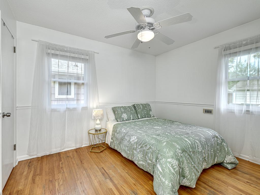The second main level bedroom atop hardwood floors.