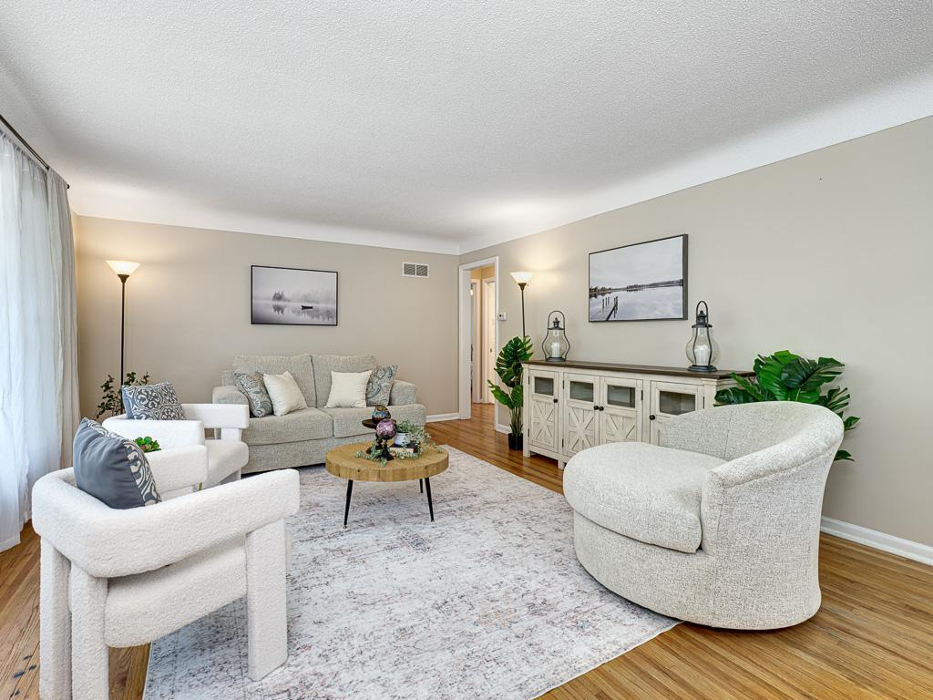 The bright, west-facing living room is spacious and welcoming.
