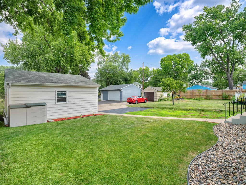 A nice, flat backyard awaits for summer fun and games.