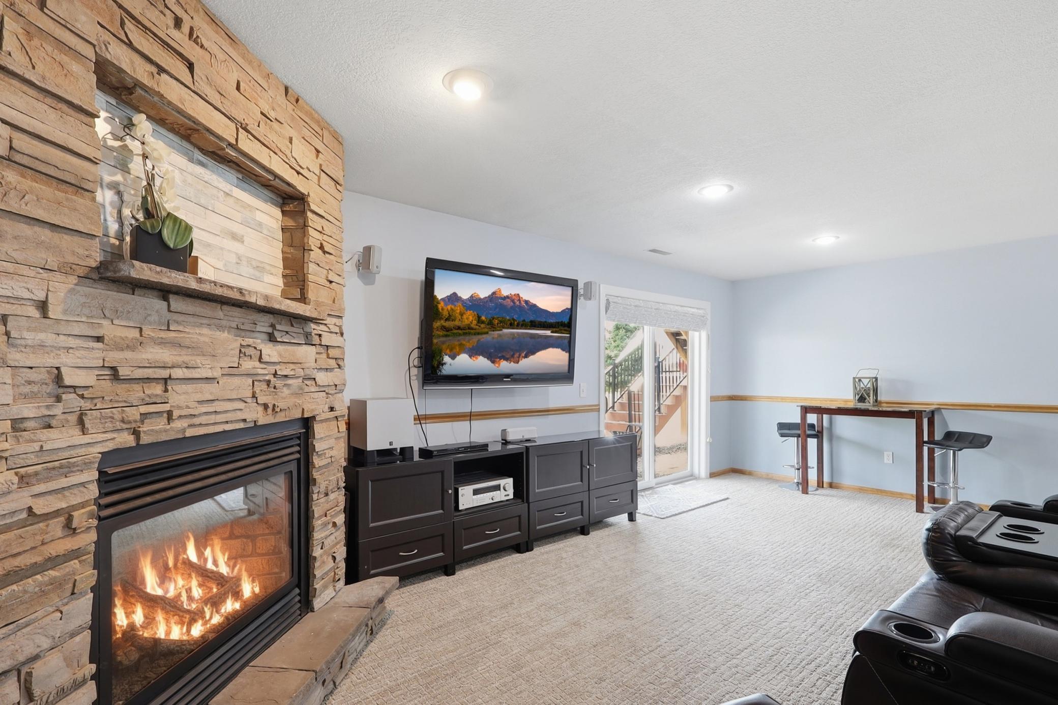 Lower level family room with fireplace, bar and walk out