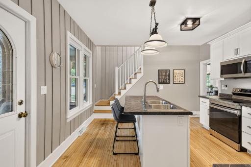 Kitchen - door to outside is left and upper level stairs ahead 1221 10th Street East Menomonie-240.jpg