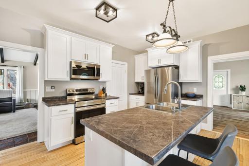 Kitchen - Note the stainless steel and upgraded counters plus wood flooring 1221 10th Street East Menomonie-242.jpg