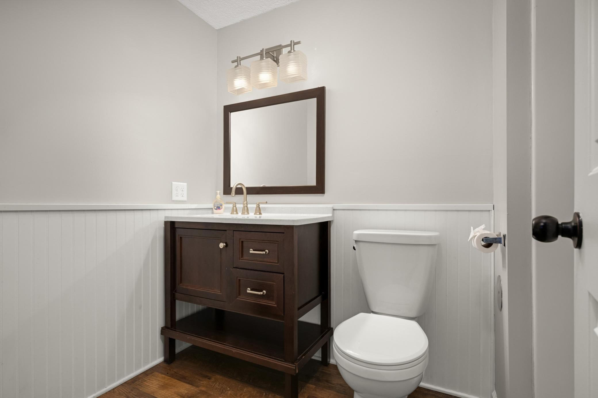 Lower level half bathroom.