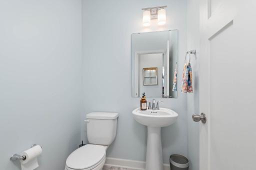 There is a handy half bath off the mudroom and entrance from the three stall garage.