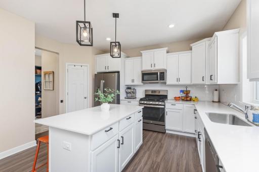Enjoy a quick meal at the center island breakfast bar. You will appreciate the oversize sink and the step in pantry provides even more excellent storage!