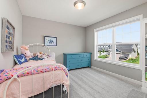 Bedroom 4 has a large window with room darkening blinds and also features a walk in closet.