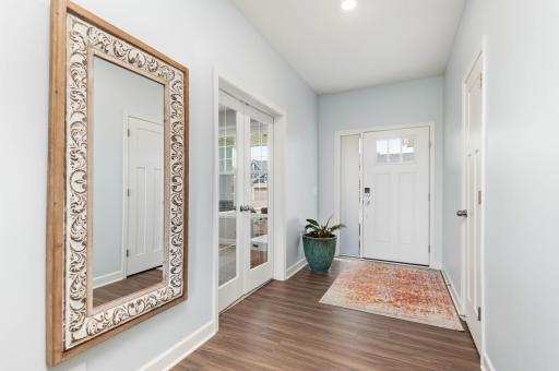Greet your guests in the large foyer area with coat closet. French doors step into the flex room or home office.