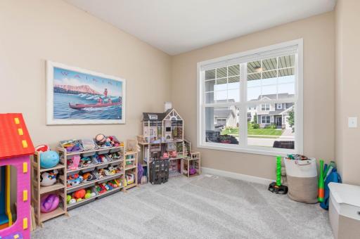 The multi use room is currently used as a wondrous kids play area! This could be a great home office space too.