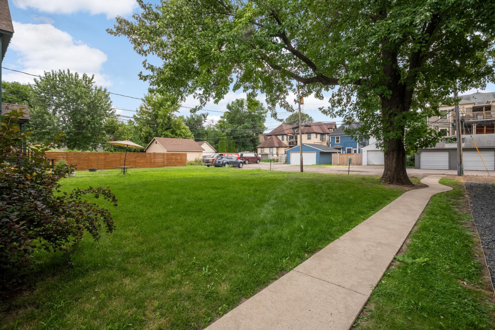 Generous backyard with easy alley access and tenant parking.