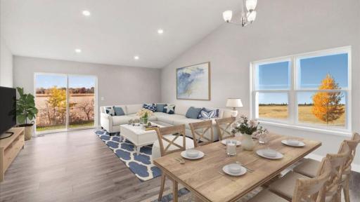 The open layout main level flows seamlessly from the kitchen through the dining room and into the living space. *Model home, colors and finishes may vary.*Model home, colors and finishes may vary.