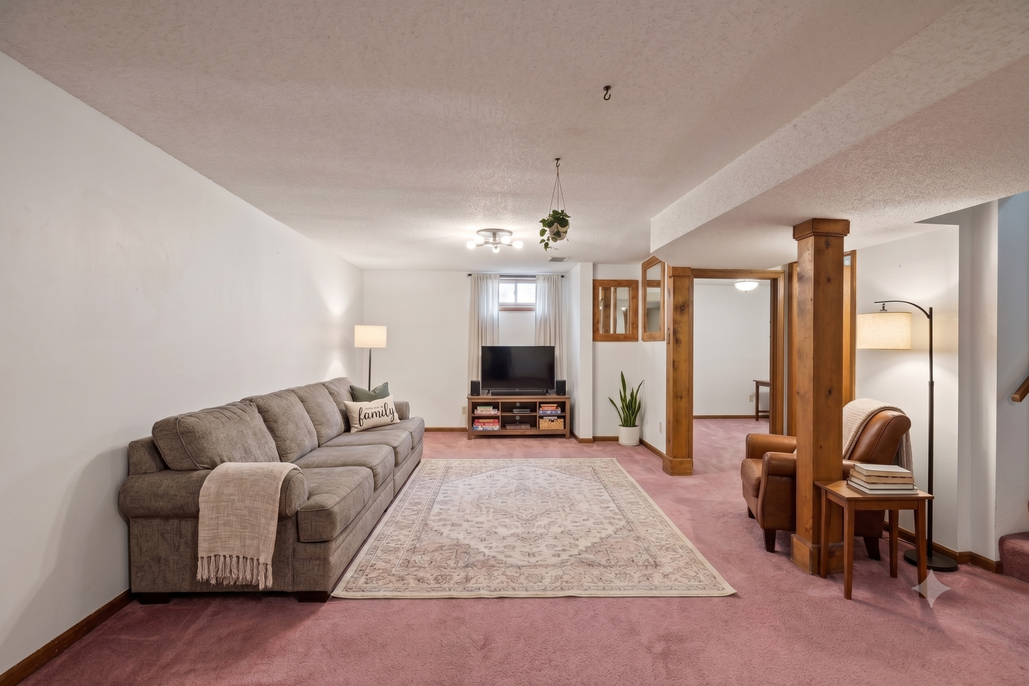 Lower level: living room (virtually staged)