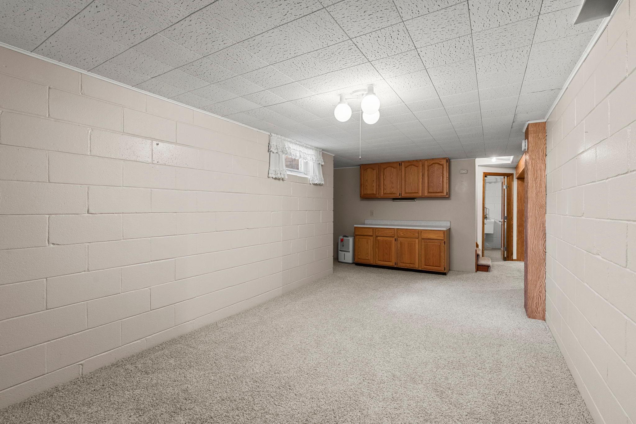Perfect for hobbies, crafts, a workshop, game room, or future bar area.