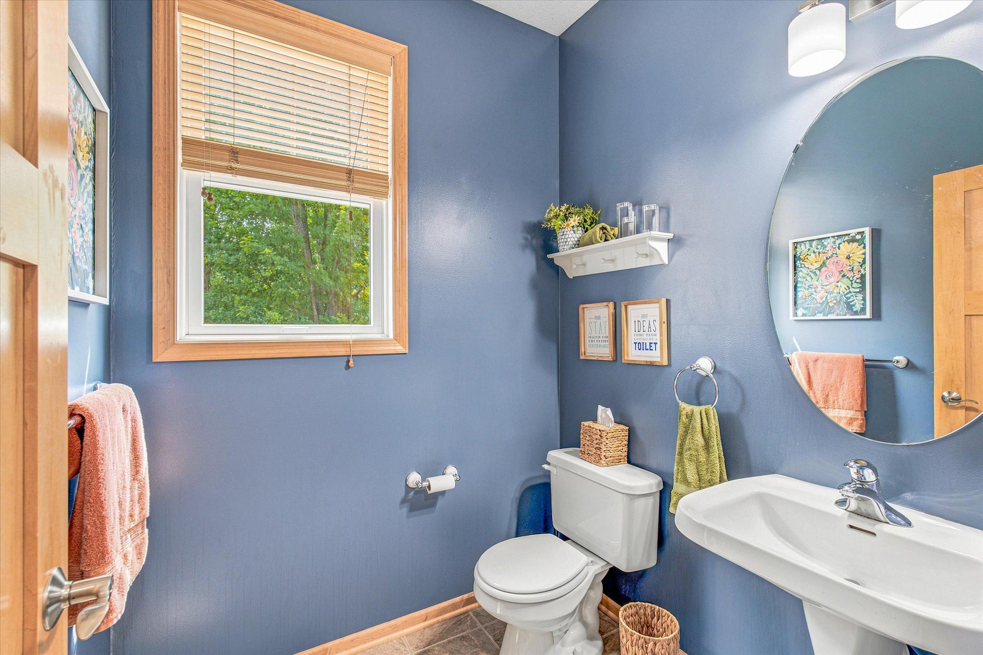 The main floor half bath is conveniently located right off of the garage entrance.