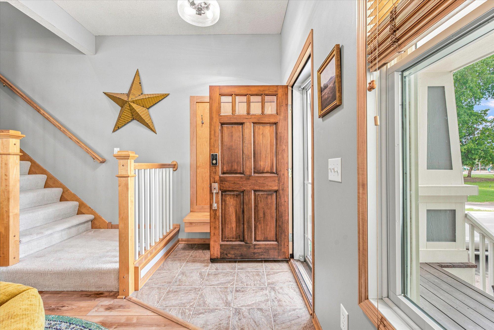 You will be greeted by tons of natural light, gorgeous wood floors and maple woodwork.
