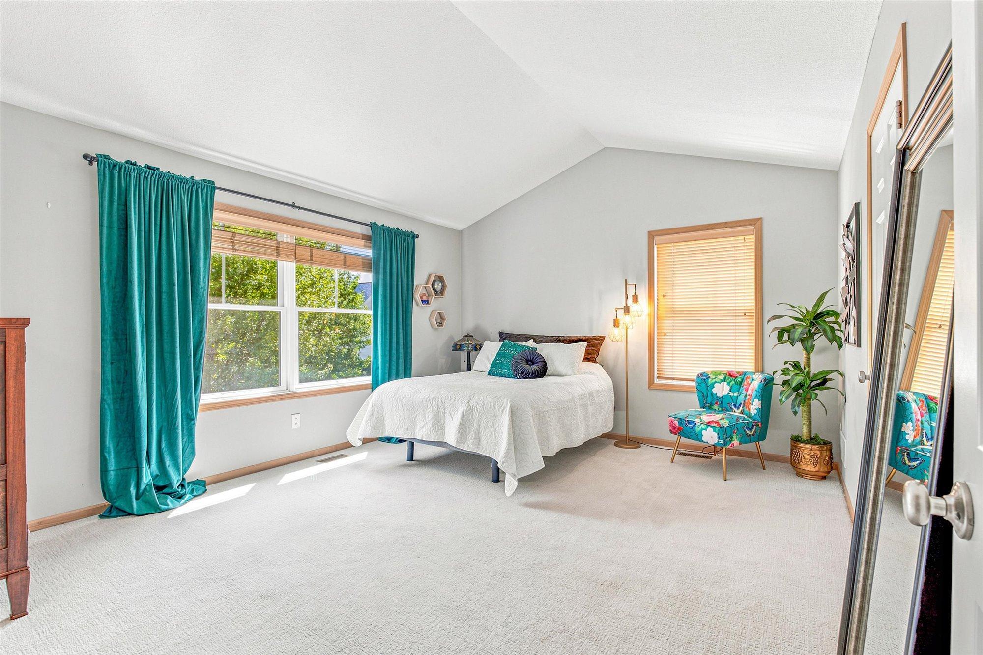 The expansive primary suite is a true sanctuary, with a private bath and large walk-in closet.