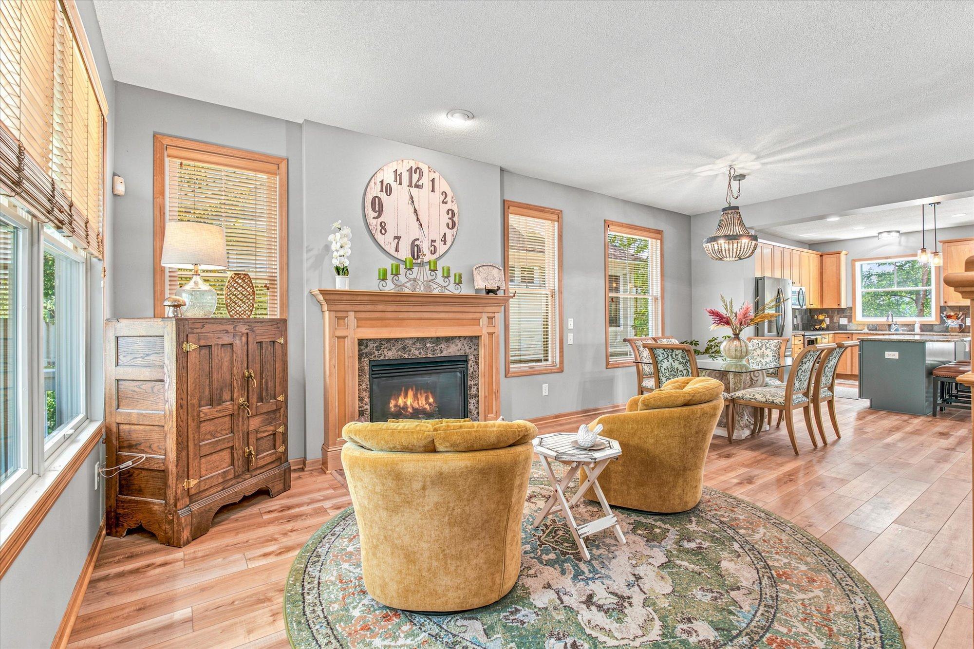 The front sitting room offers a cozy place to visit by the fireplace.