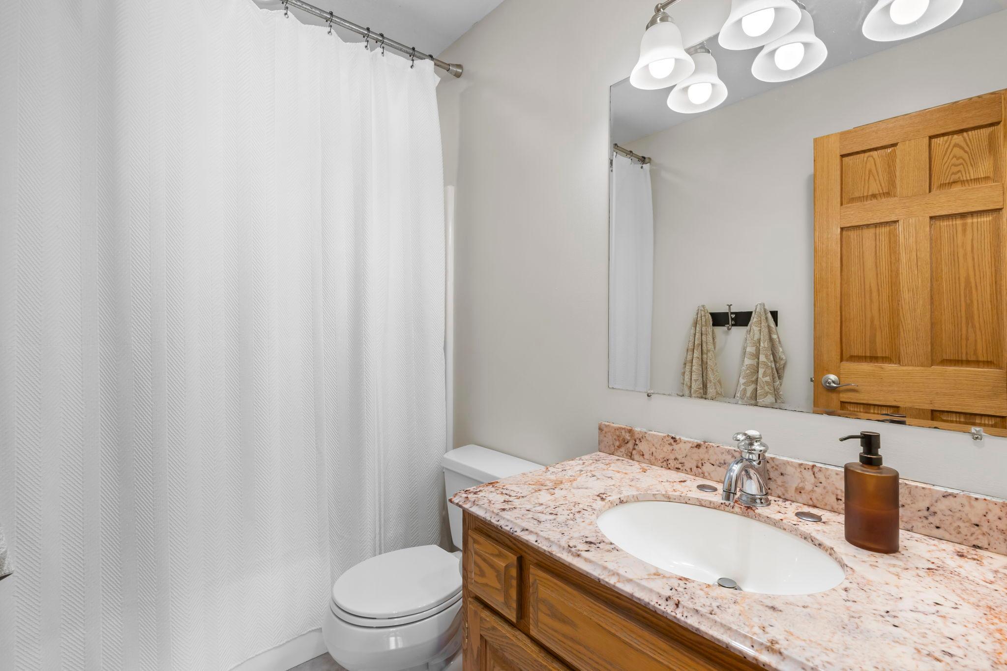 Nearby shared full bathroom.