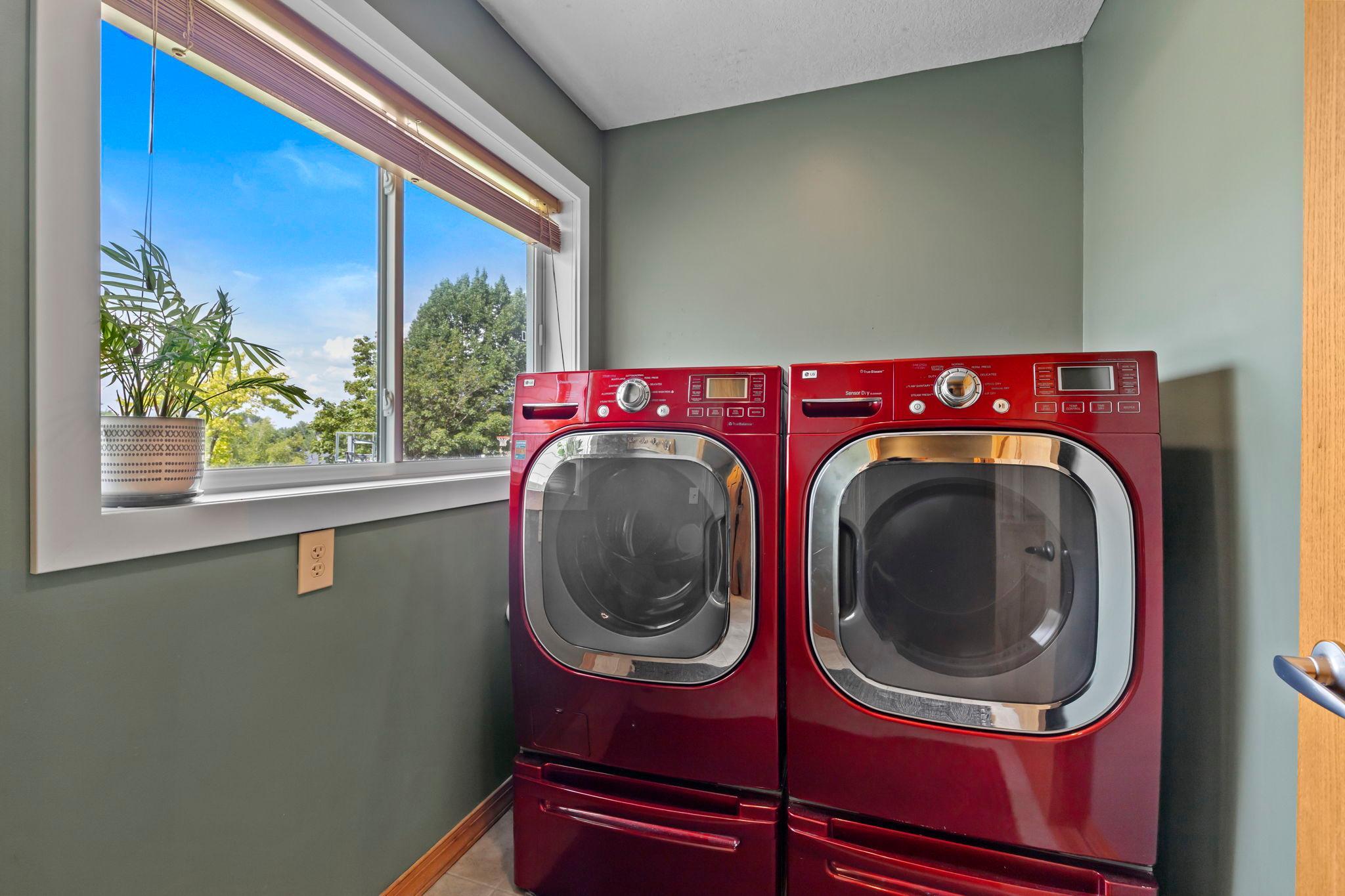 Nearby, the laundry and mudroom create a practical everyday entry from the garage.