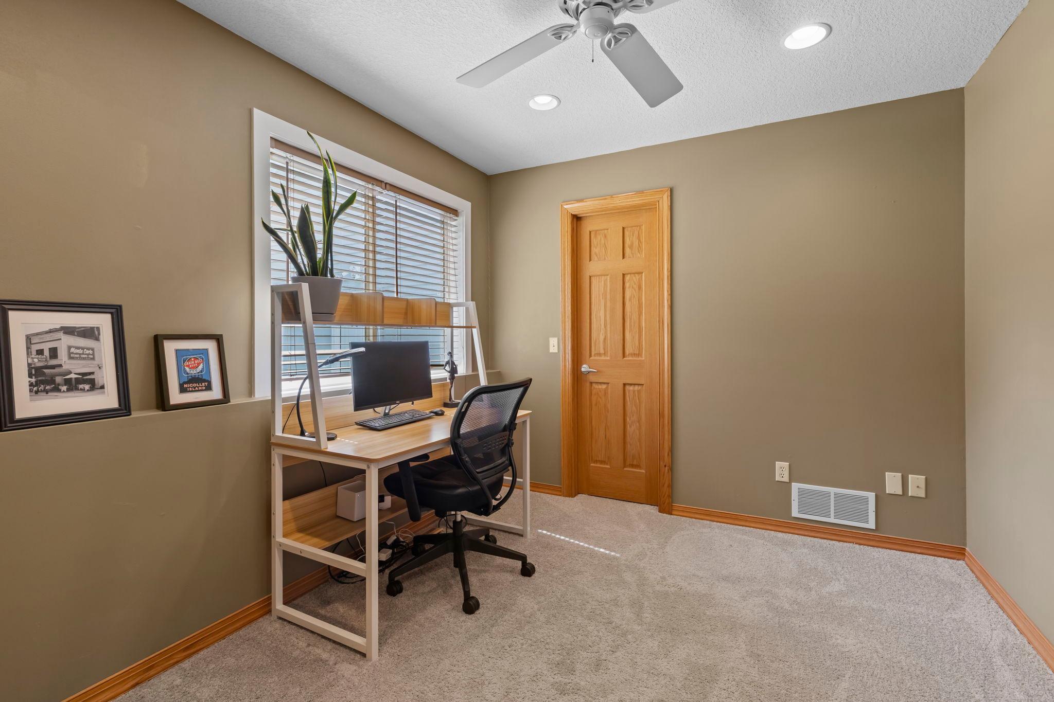 A flexible main-level room with a walk-in closet gives you options for a home office, bedroom, playroom, or hobby space.
