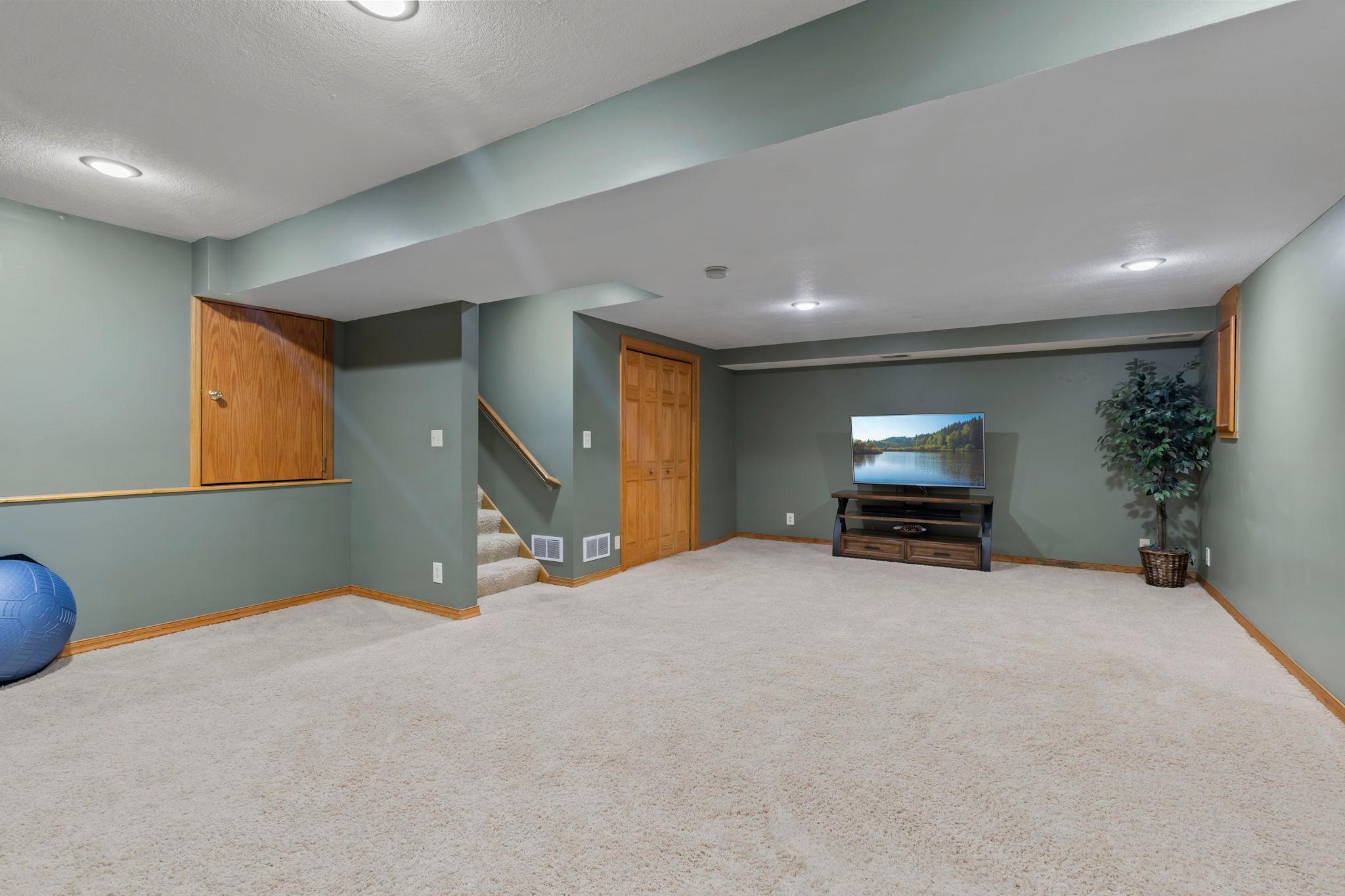 Plush carpet, dimmable lighting, and abundant storage in the oversized crawl space make this level just as functional as it is comfortable.