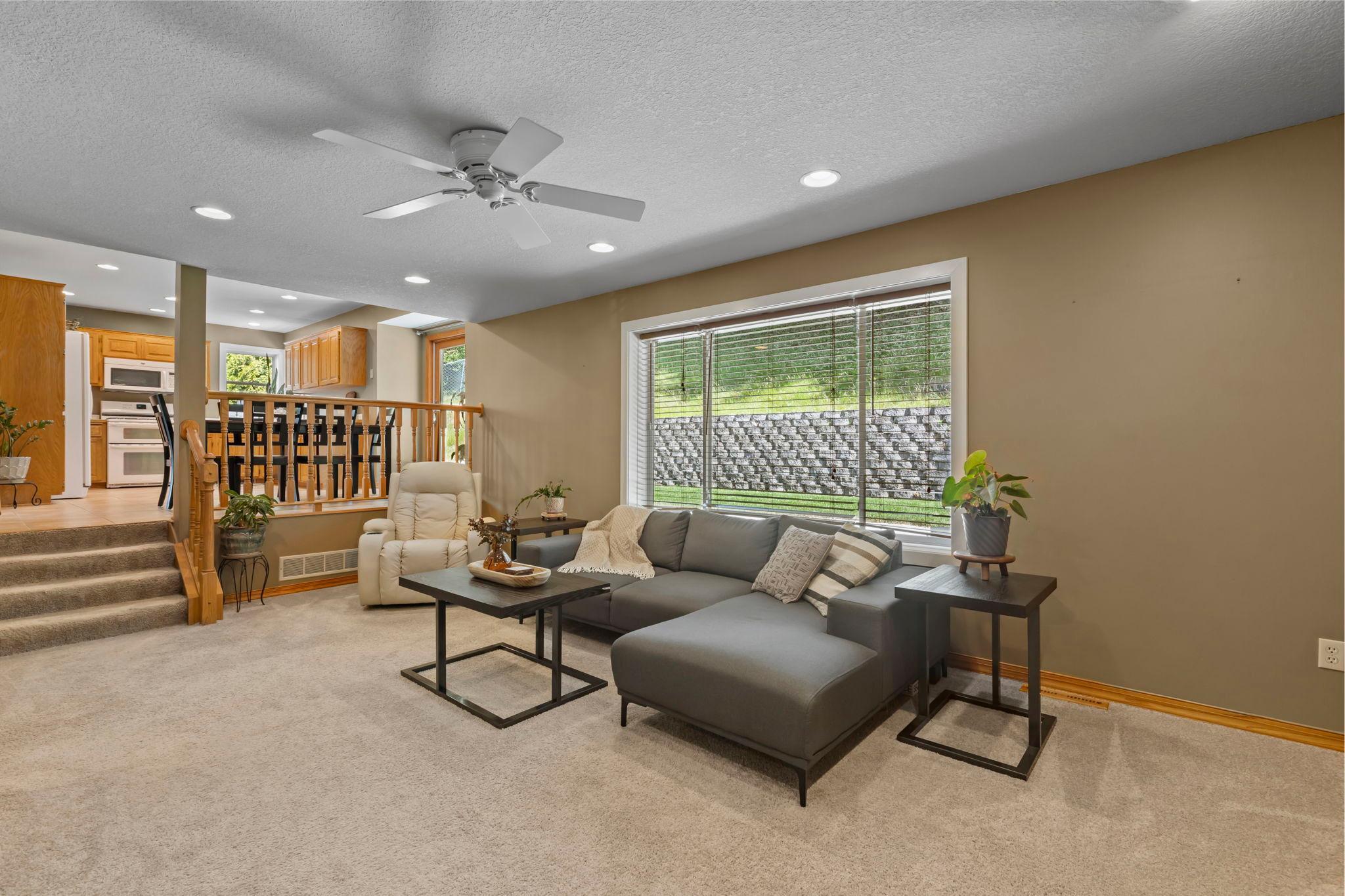 Floor-to-ceiling brick fireplace, built-in shelving, and comfortable layout.
