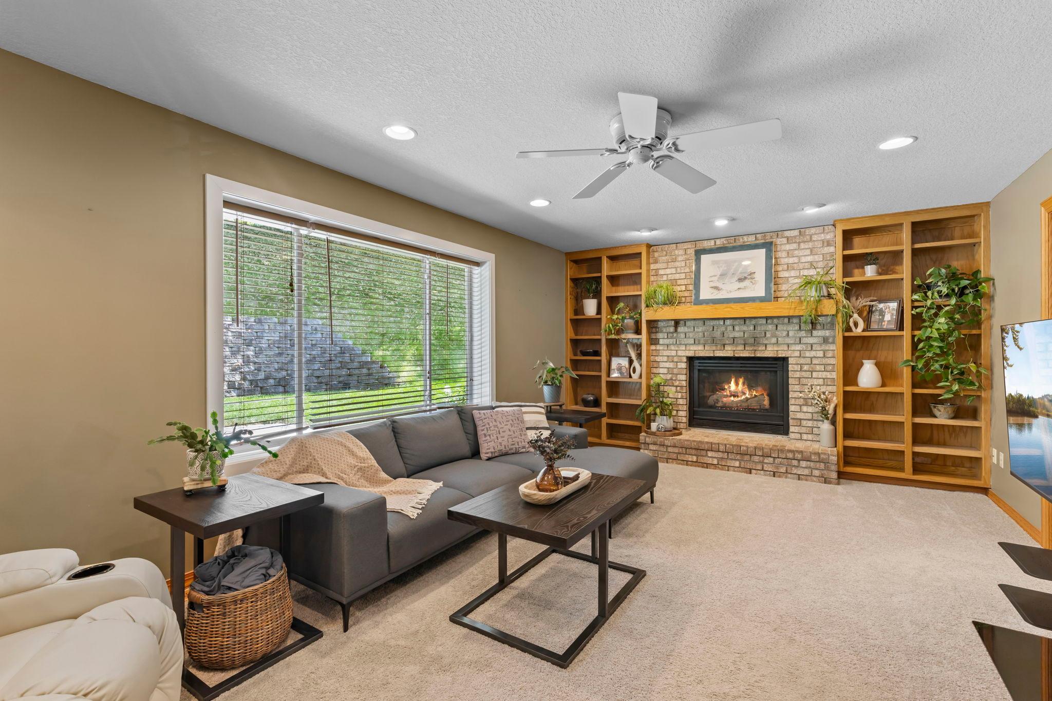 Just beyond, the family room is the heart of the home.
