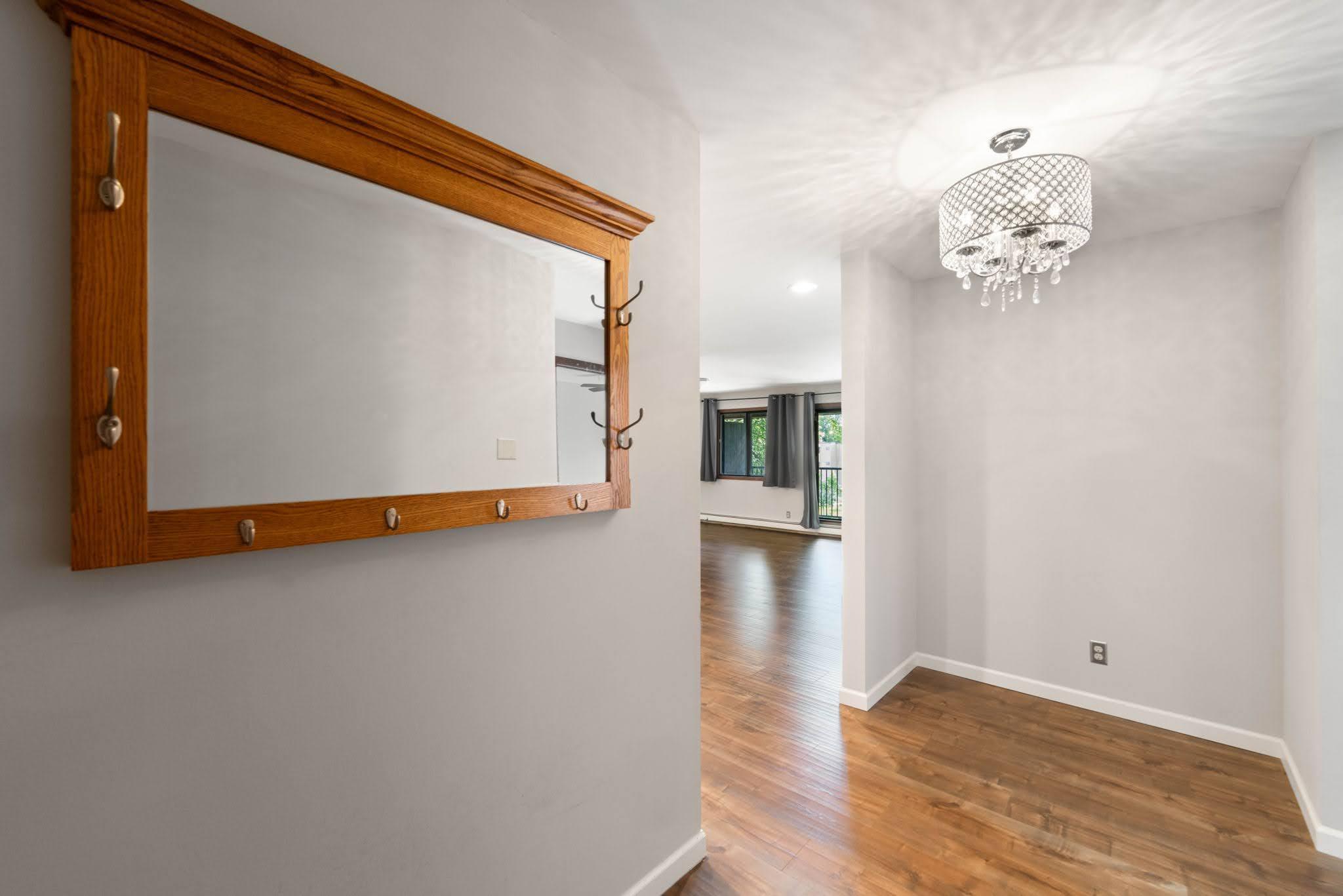 Condo entrance is spacious with nook area for entry table