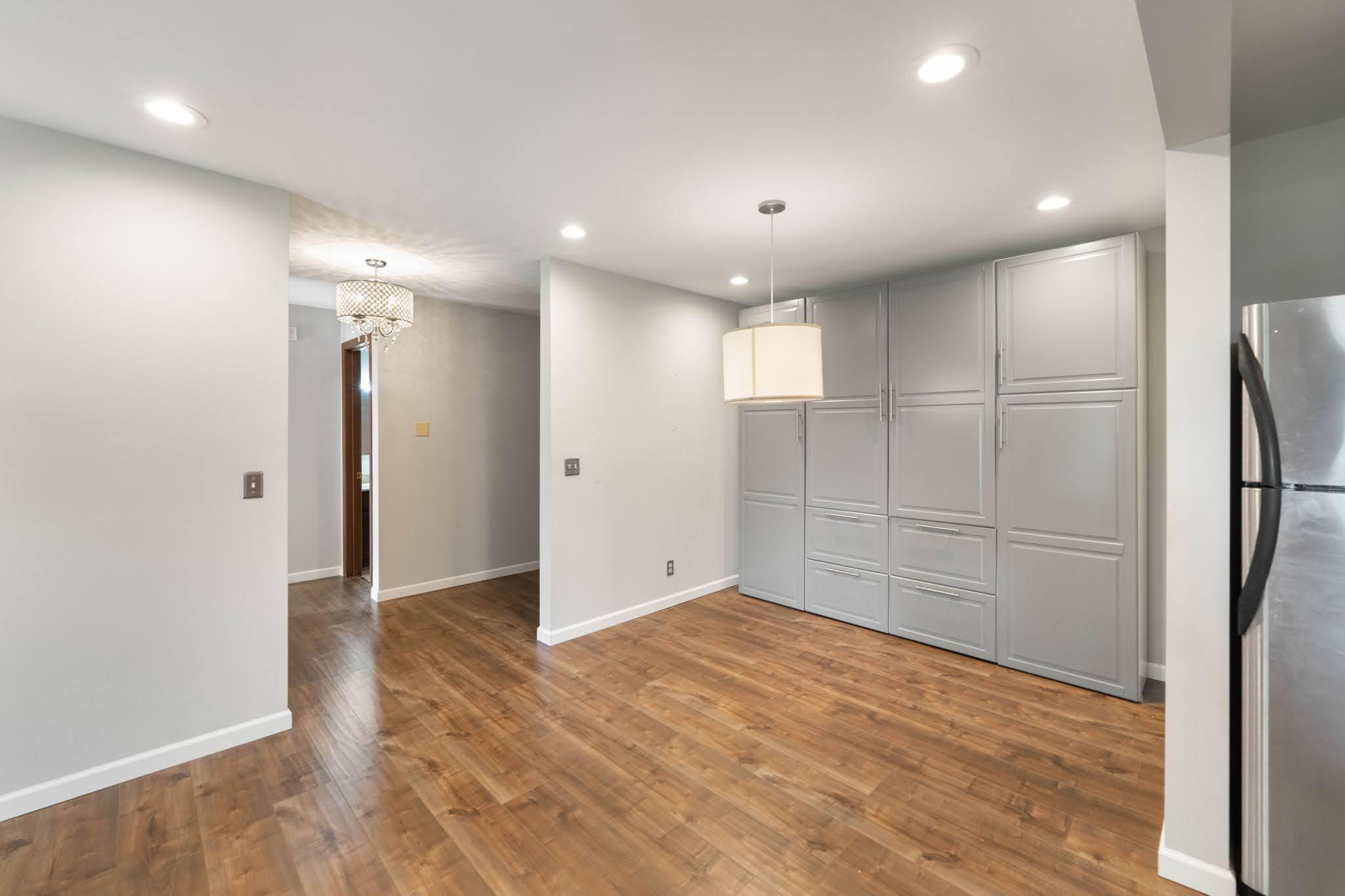 Dining area has storage galore with built-ins along the back wall