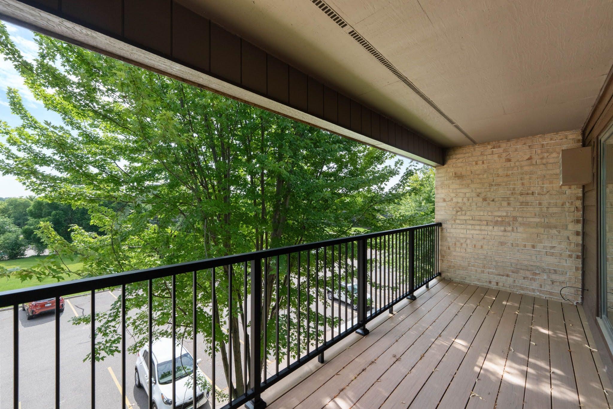 Covered deck with added privacy from property trees
