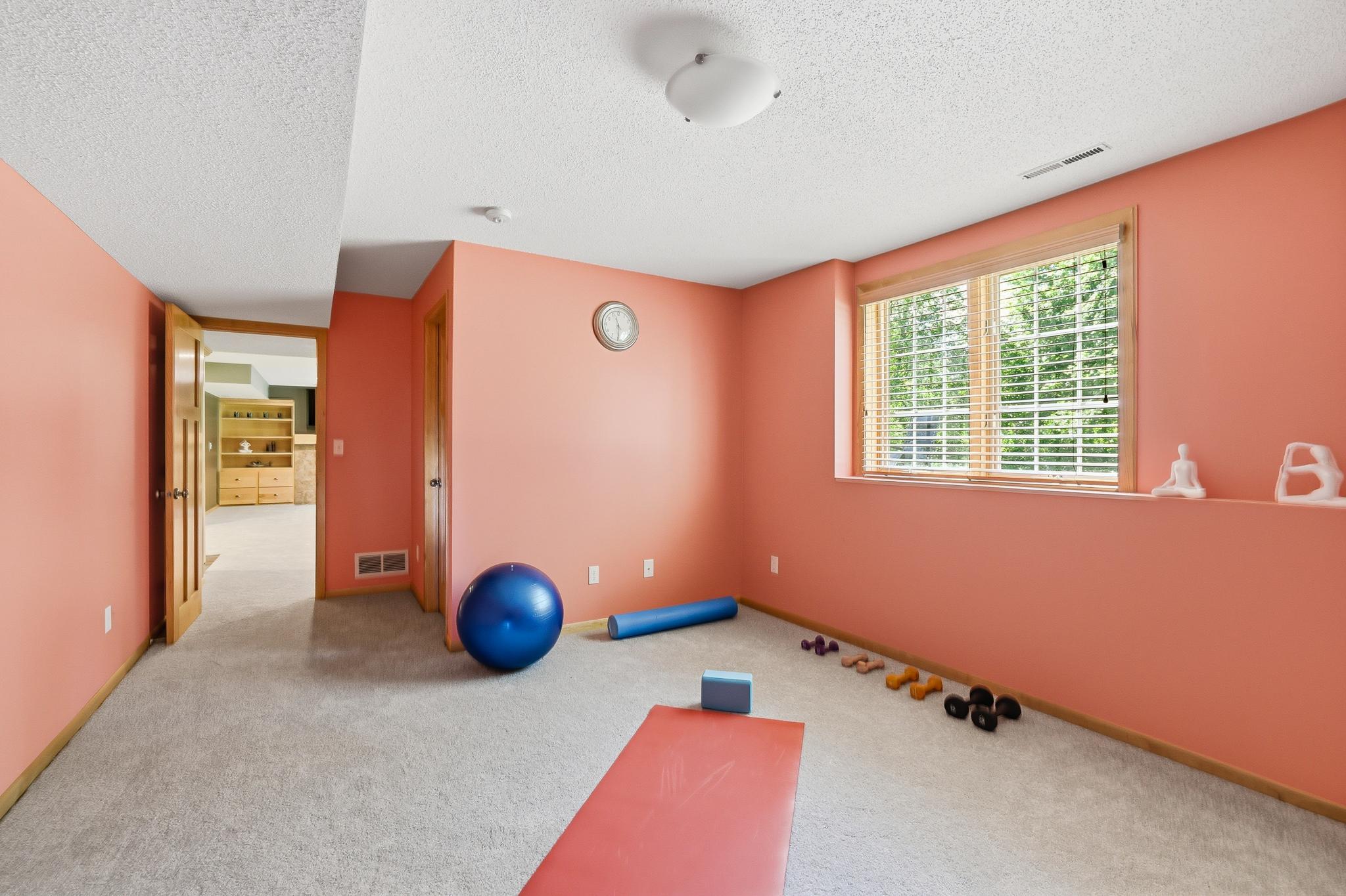 There is a 5th bedroom or workout space. There is a walk-in closet in this room and lots of light.