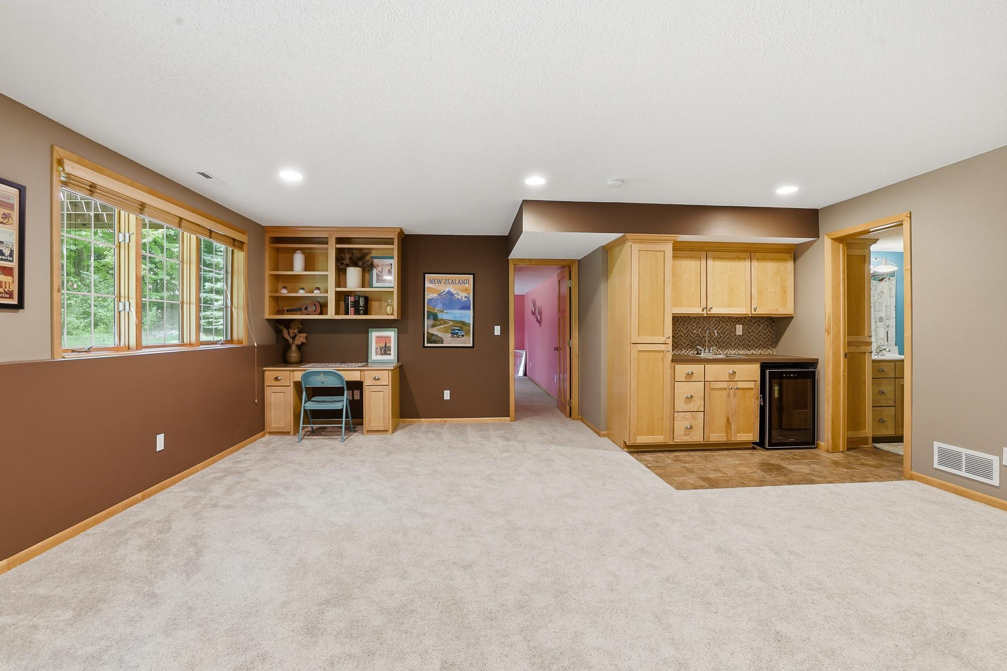 In the lower level there is a wet bar, bedroom, full bathroom and storage!