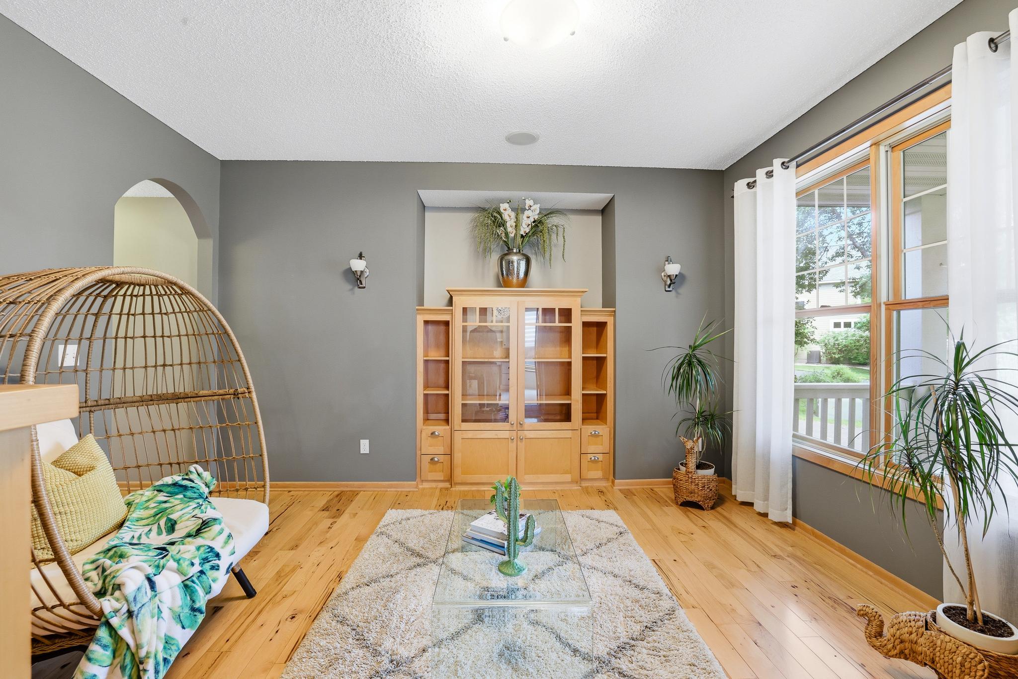 Formal dining room with built-ins and large picture window.