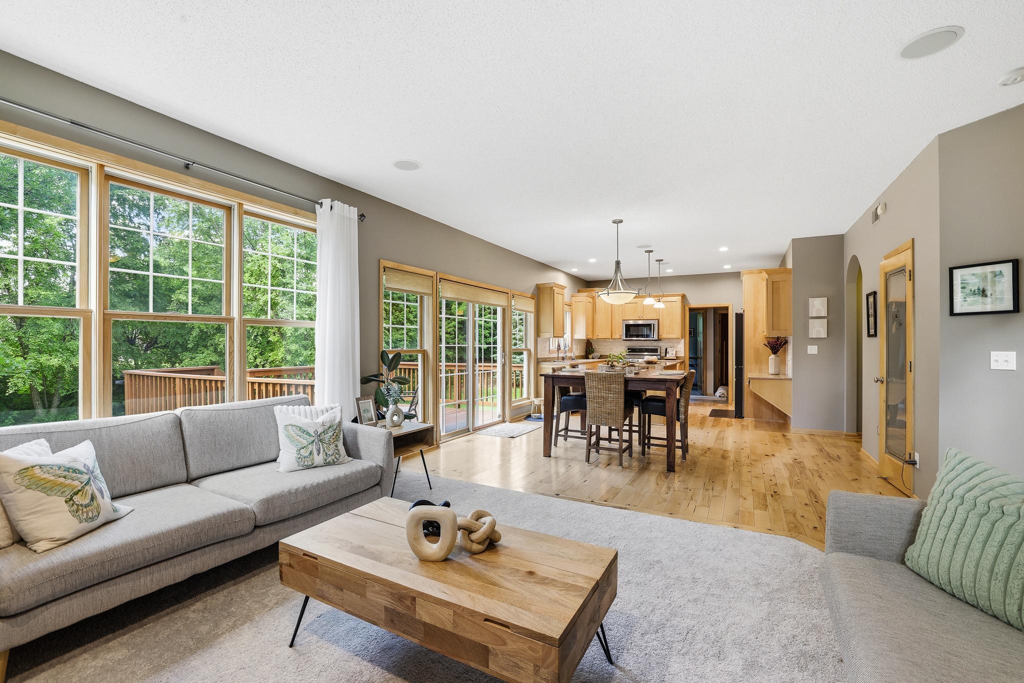 Large picture windows and sliding glass doors to the deck make this welcoming and bright.