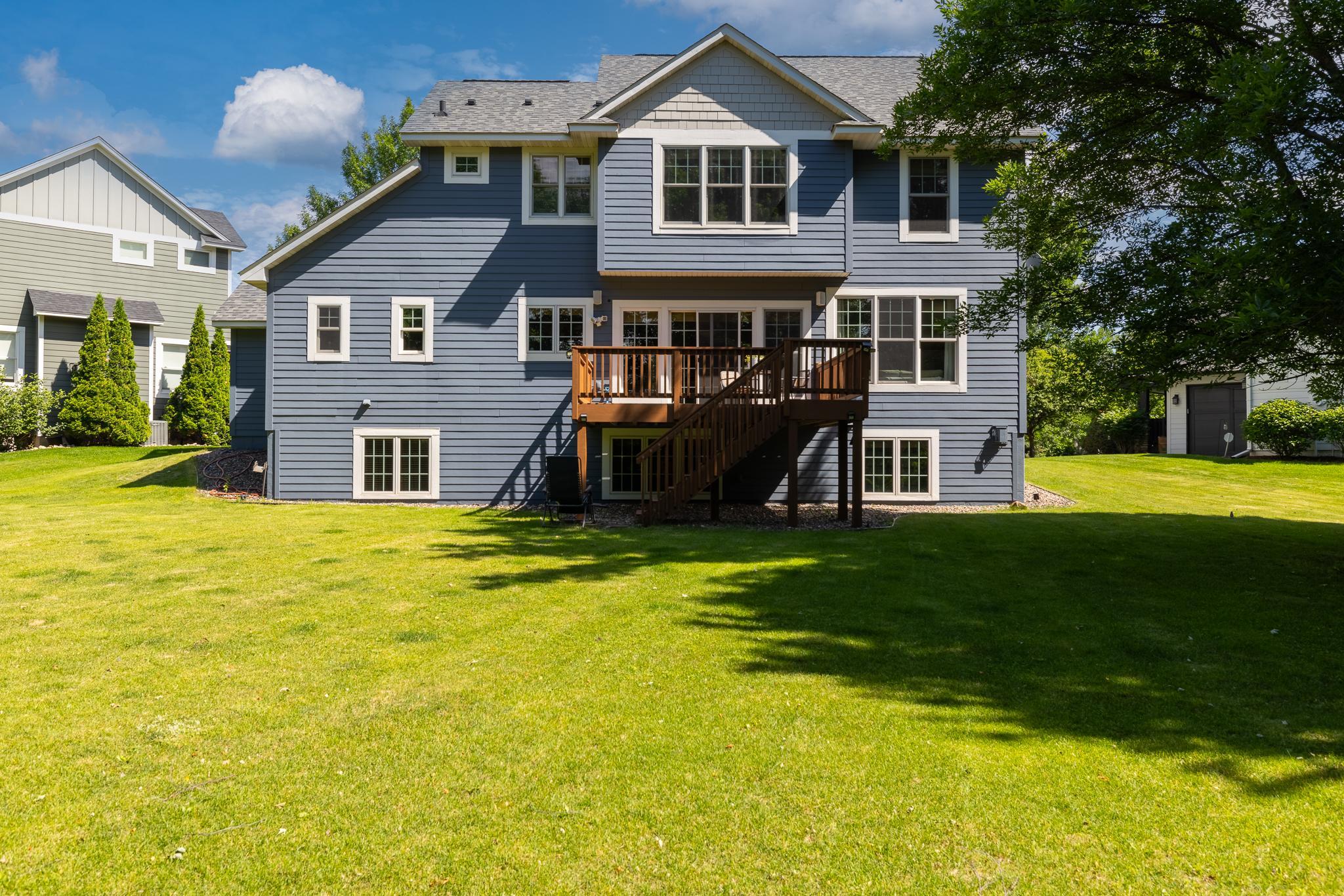 Large deck over-looks the backyard.
