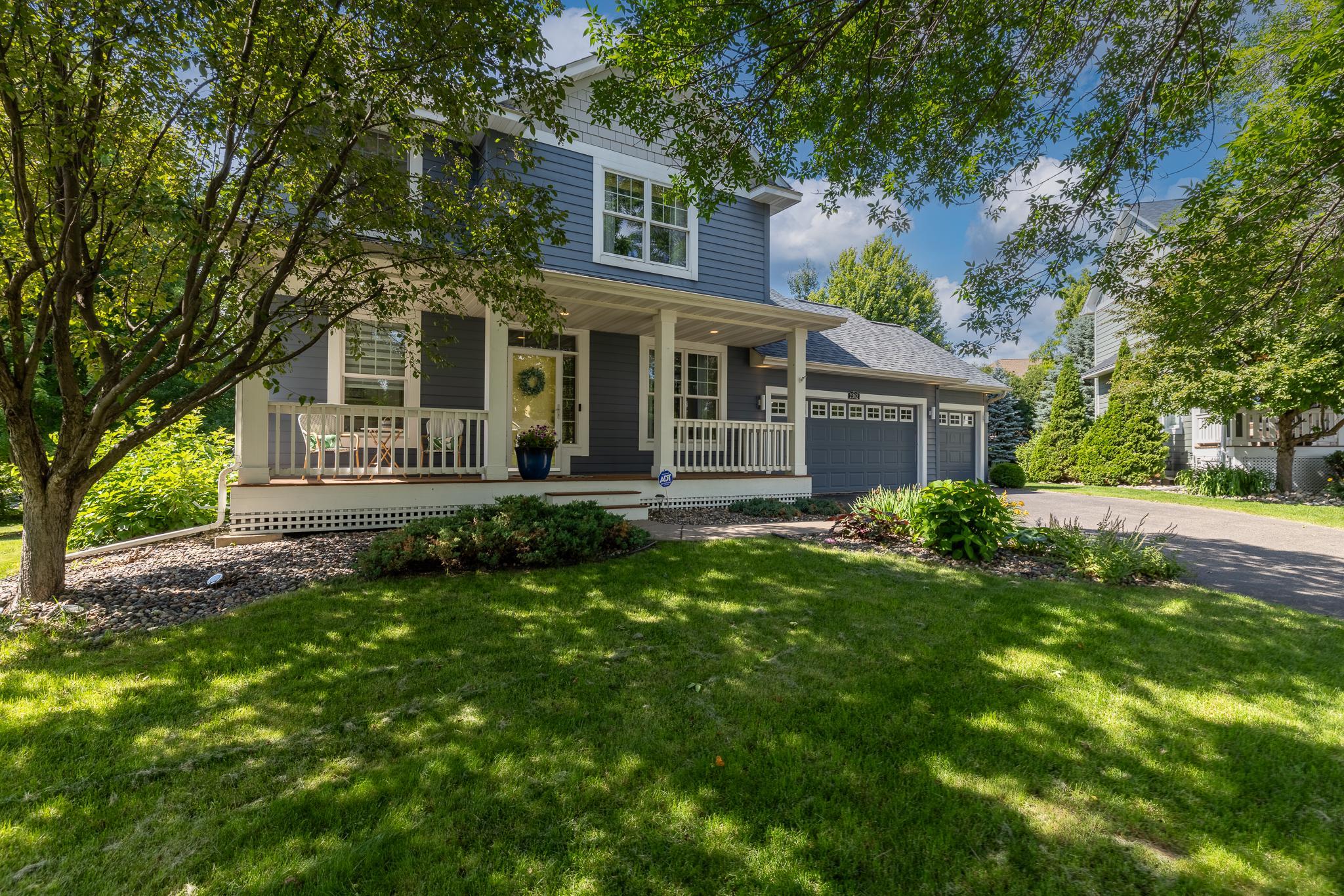 Lovely landscaping and mature trees offer shade and privacy in the backyard.