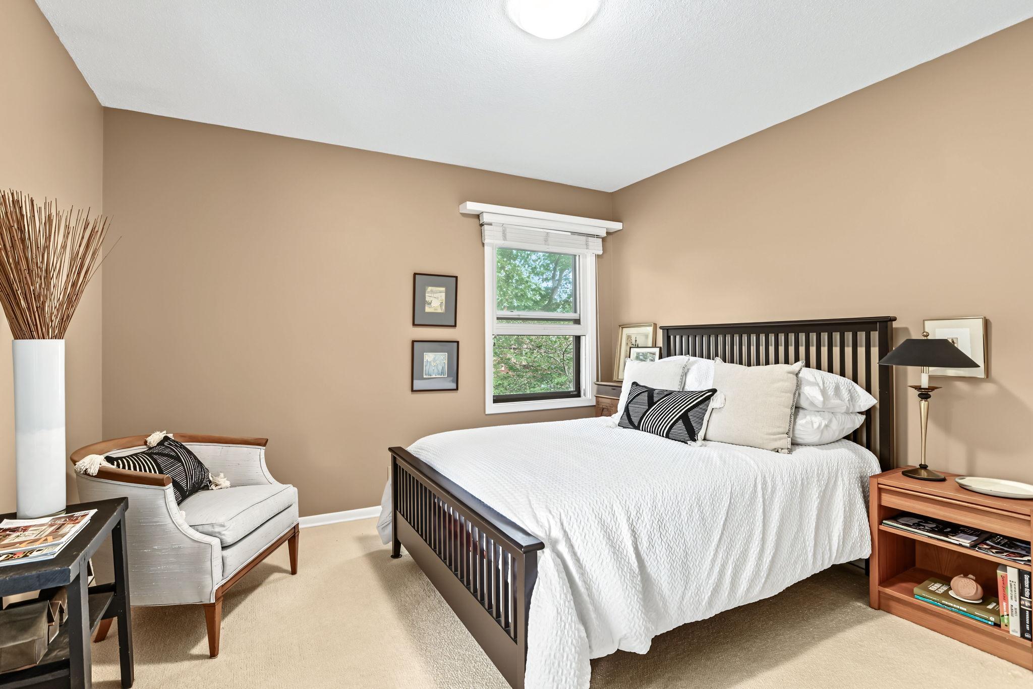 Second bedroom on upper level has hardwood floors under the area rug!