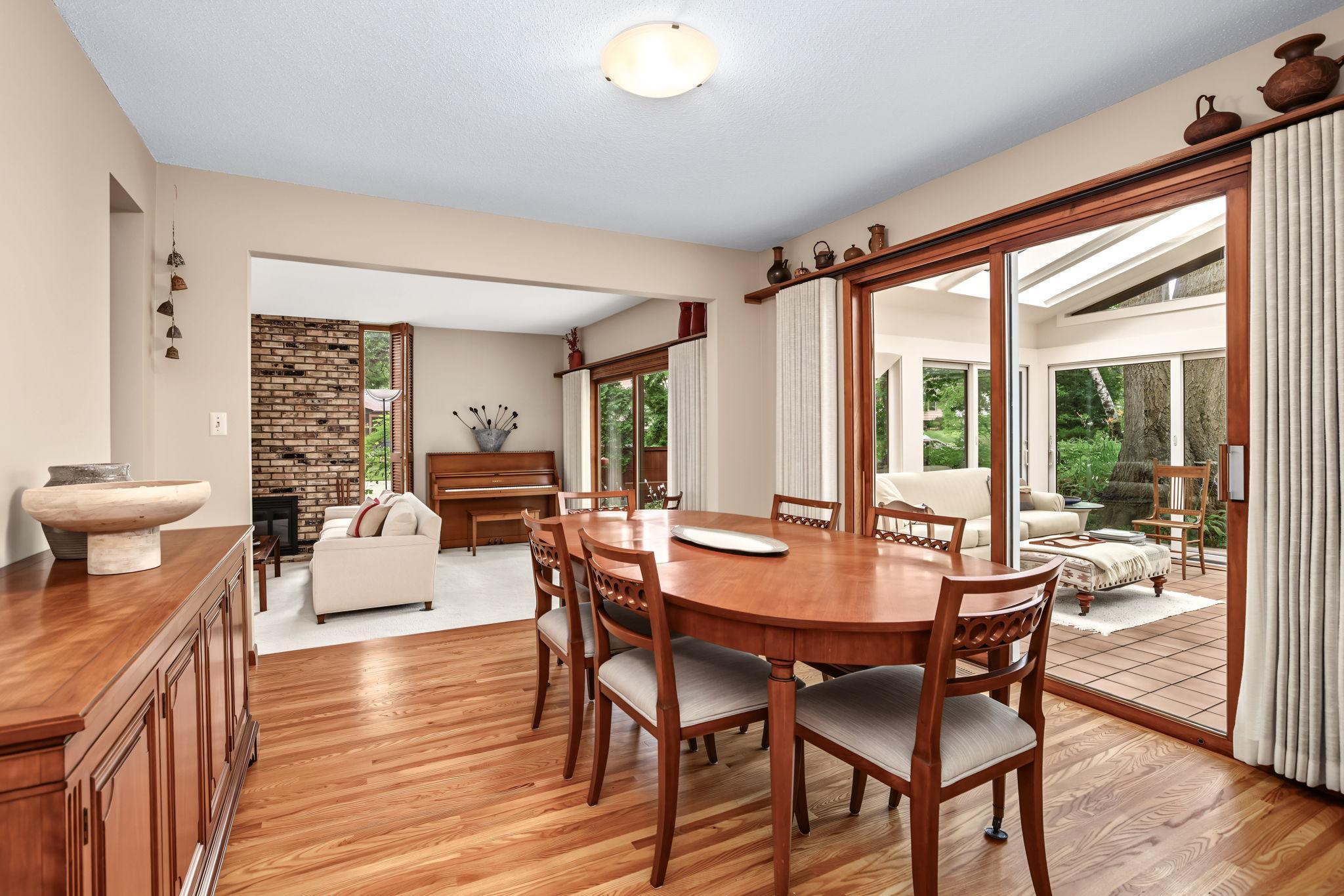 Dining room next to kitchen also has sliding doors that open to sunroom.