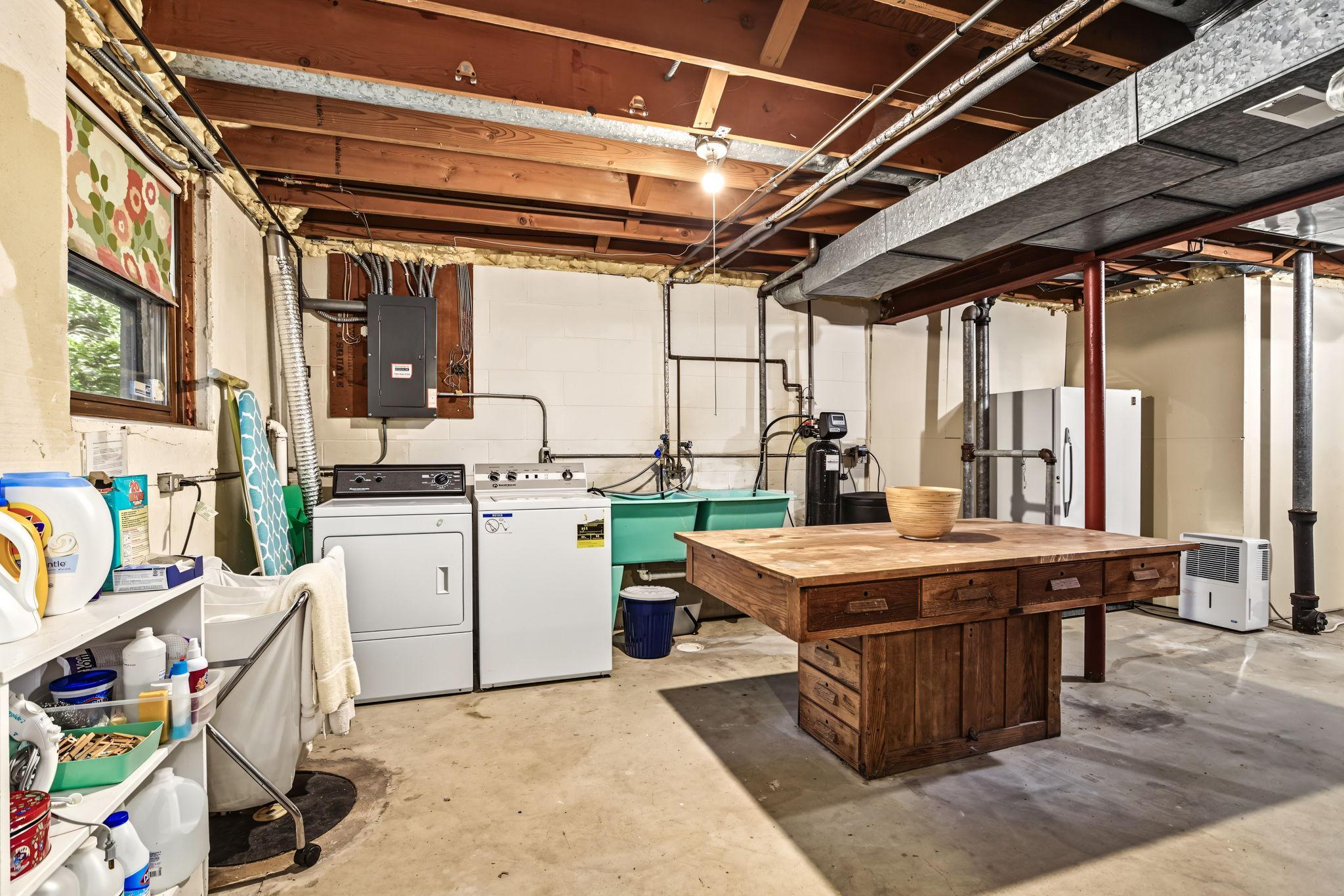Lower level has a door to backyard and so much storage space.